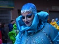 TORREVIEJA, SPAIN FEBRUARY 12, 2023: Participants dressed in a colorful carnival costumes on the street during the traditional