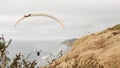 Torrey Pines paragliding flight. Paraglider flying. California ocean coast cliff Royalty Free Stock Photo