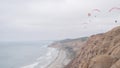 Torrey Pines paragliding flight. Paraglider flying. California ocean coast cliff Royalty Free Stock Photo