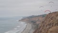 Torrey Pines paragliding flight. Paraglider flying. California ocean coast cliff Royalty Free Stock Photo