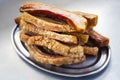 Plate of Torreznos on a metallic plate on a grey kitchen background. Royalty Free Stock Photo