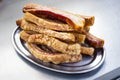 Plate of Torreznos on a metallic plate on a grey kitchen background. Royalty Free Stock Photo