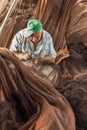 Fisherman mending fishing nets in the port in coastline of Torrox