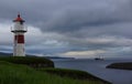 Torshavn lighthouse and ship on Faroe Islands