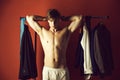 Torso of muscular man in underwear pants, wardrobe, shopping hanger Royalty Free Stock Photo