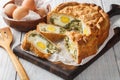 Torta Pasqualina is an traditional Italian Easter speciality made of puff pastry, ricotta cheese, spinach and eggs closeup on the