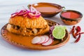 Tortas ahogadas, traditional Mexican Food from Jalisco Guadalajara Mexico, spicy sandwich in a red sauce