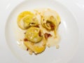 Tortelli on parmesan fondue and crunchy pig jowl