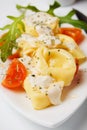 Tortellini pasta with cheese sauce and tomato Royalty Free Stock Photo