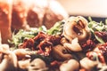 Tortellini salad with mushrooms, dried tomatoes, arugula and herbs - In addition, home-baked Parmesan roll - Shallow depth of Royalty Free Stock Photo