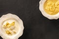 Tortellini served with broth and cream sauce, Italian food on a black background Royalty Free Stock Photo