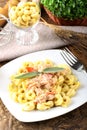 Tortellini with tomato, ham and cream