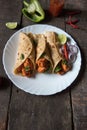 Tortilla or chicken wraps made out of flat bread with chunks of chicken pieces