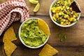 Tortilla chips with dips, guacamole and salsa Royalty Free Stock Photo