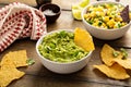 Tortilla chips with dips, guacamole and salsa Royalty Free Stock Photo