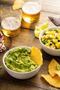 Tortilla chips with dips, guacamole and salsa Royalty Free Stock Photo