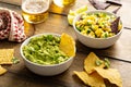 Tortilla chips with dips, guacamole and salsa Royalty Free Stock Photo