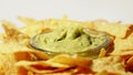 Tortilla chips and guacamole dip on the plate, close-up shot Royalty Free Stock Photo