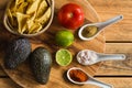 Tortilla chips and ingredients for guacamole dip Royalty Free Stock Photo