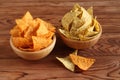 Tortilla chips nachosÃ¢â¬â¢ Mexican and tortilla chips with chia seeds in bamboo bowls on wooden table. Royalty Free Stock Photo