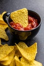 Tortilla chips and red tomato salsa dip. Mexican nacho chips Royalty Free Stock Photo