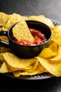 Tortilla chips and red tomato salsa dip. Mexican nacho chips Royalty Free Stock Photo