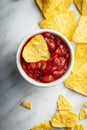 Tortilla chips and red tomato salsa dip. Mexican nacho chips Royalty Free Stock Photo