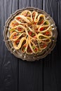 Tortilla stuffed with meat beef, peppers and onions closeup. Vertical top view Royalty Free Stock Photo
