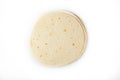 Tortilla on a white isolated background. Corn tortilla or simply tortilla is a type of thin unleavened bread made from Hominy