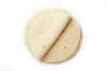 Tortilla on a white isolated background. Corn tortilla or simply tortilla is a type of thin unleavened bread made from Hominy