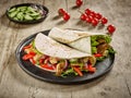 Tortilla wraps with fried chicken meat and vegetables Royalty Free Stock Photo