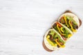 Tortilla wraps with grilled beef meat, salad, parsley, tomato, pepper on wooden board. Royalty Free Stock Photo