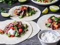 Tortillas with vegetables and beef steak slices. Avocados, tomatoes, red onions and meet with cilantro and lime juice in tortillas Royalty Free Stock Photo