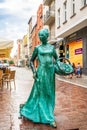 Torun, Poland - August 11, 2021. Statue of woman baker on Male Garbary street - Ginger bread woman baker monument - Pomnik Piernik