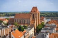 Torun, Poland - August 19, 2022: View from tower on Basilica of Saint John and old or modern buildings in center of city Torun Royalty Free Stock Photo