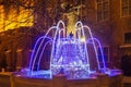 TORUN, POLAND - JANUARY 08, 2016: Night winter view of the fountain with the Christmas decoration in the historical part of the