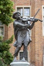 Statue of a raftsman playing the fiddle surrounded by frogs, Torun, Poland