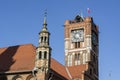 Torun town hall of Ratusz Staromiejski clock tower from 18th century with Polish flag Royalty Free Stock Photo