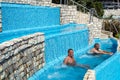 Torvaianica, Italy - July 2017: People having fun in the swimming pool in water park at Zoomarine acqua park