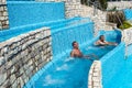 Torvaianica, Italy - July 2017: People having fun in the swimming pool in water park at Zoomarine acqua park