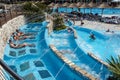 Torvaianica, Italy - July 2017: People having fun in the swimming pool in water park at Zoomarine acqua park