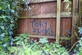 A Tory Scum! Graffiti Sign Spray painted on a Fence