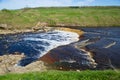 Tosnensky Gertovsky waterfall, sunny May day. Ulyanovka, Leningrad region. Russia Royalty Free Stock Photo