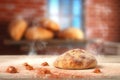 tossed pizza dough with a blurred brick oven background