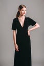 Total black look. Black velours trumpet dress. Evening floor length gown with deep v neck line and short sleeves