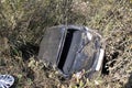 Total car crash on higway. Back of the car without windows. The car in the bushes flew off the curb Royalty Free Stock Photo