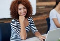 Total career satisfaction. Portrait of an attractive young woman working on a laptop while sitting in an office. Royalty Free Stock Photo