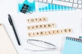 Total current liabilities concept with letters on cubes Royalty Free Stock Photo