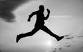 total freedom. personal achievement goal. man silhouette jump on sky background. confident businessman running. daily