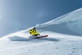 The total length of skiing on fresh snow powder. Professional skier outside the track on a sunny day